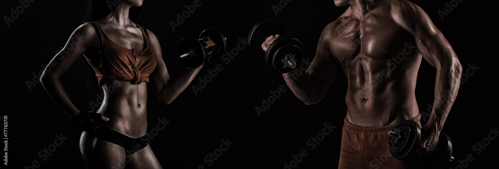 Bodybuilding. Strong man and a woman posing on a black backgroun - obrazy, fototapety, plakaty 