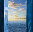 room with open door  to seascape