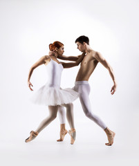 Wall Mural - Couple of sporty ballet dancers in a classic performance