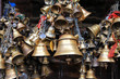 Metal sacrificial bells hanging on chain at Kumbeshwar Temple