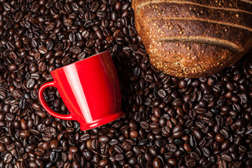 Wall Mural - Cup of coffee and black bread on coffee beans