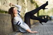 © javiindy - Funny female model of fashion with high heels sitting on the flo