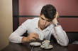 © theartofphoto - Stressed Handsome Man Having a Cup of Coffee at the Cafe