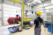© industrieblick - Techniker kontrolliert Heizungsanlage in d. Industrie