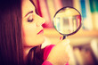 © Voyagerix - Funny girl holding magnifying glass