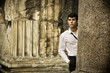 © theartofphoto - Handsome young man between ancient marble columns