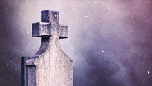 Cross On The Cemetery During Snowfall