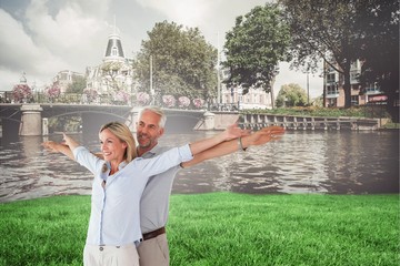 Aufkleber - Composite image of happy couple standing with arms outstretched