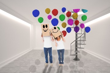 Poster - Composite image of mature couple wearing boxes over their heads
