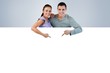 © WavebreakmediaMicro - Young couple pointing at advertisement below them