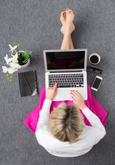 Smart woman working with computer, view from above