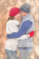 Aufkleber - Composite image of happy couple in warm clothing hugging