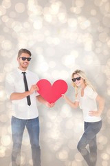 Aufkleber - Composite image of cool young couple holding red heart
