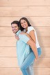 © WavebreakmediaMicro - Happy casual man giving pretty girlfriend piggy back