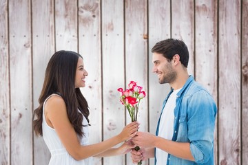 Poster - Composite image of happy hipster giving his girlfriend roses