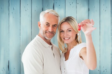 Aufkleber - Composite image of happy couple showing their new house key