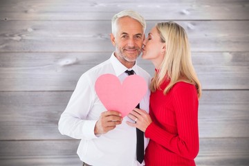 Aufkleber - Handsome man holding paper heart getting a kiss