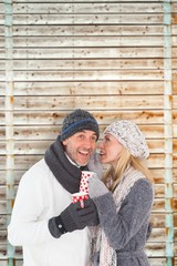 Aufkleber - Composite image of happy couple in winter fashion holding mugs