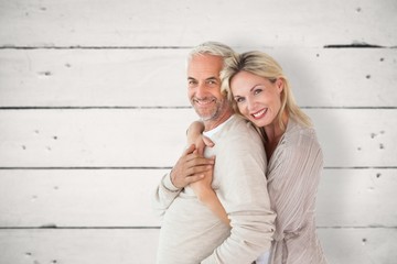Aufkleber - Composite image of happy couple standing and hugging