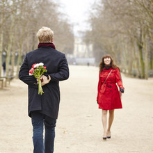 Man Is Going To Offer Flowers To His Girlfriend