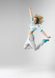 © konradbak - Blond athlete dancing and jumping