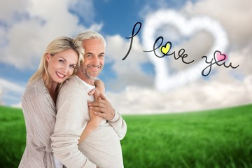Poster - Composite image of happy couple standing and hugging