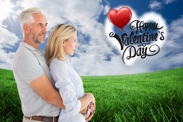 Poster - Composite image of happy couple smiling and embracing