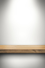 empty wood shelf on white wall