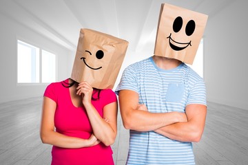Poster - Composite image of young couple with bags over heads