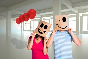 Aufkleber - Composite image of young couple with bags over heads