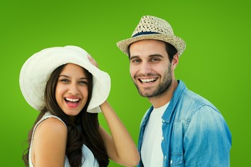 Poster - Composite image of happy hipster couple smiling at camera