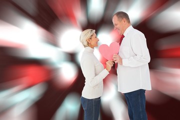 Poster - Older affectionate couple holding pink heart