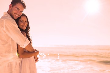 Aufkleber - Smiling couple hugging and looking