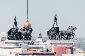 Statues on roof of Banco Bilbao Vizcaya Madrid Spain