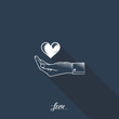 Heart in hand on dark blue background with long shadow.