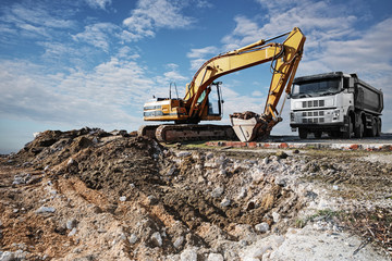 Excavator and truck on a construction site