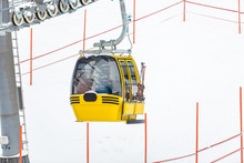 Yellow Cable Car On Alpine Ski Slope