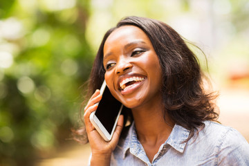 young african woman talking on smart phone