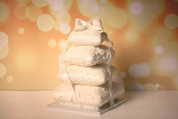 beautiful 4tier white cake in pillow shape