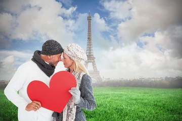 Poster - Smiling couple in winter fashion posing with heart shape