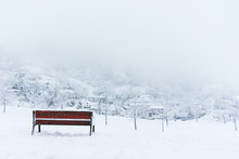 Bench And Snowy Winter Landscape