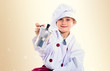 © luismolinero - Blonde little girl dressed like chef holding coffee pot