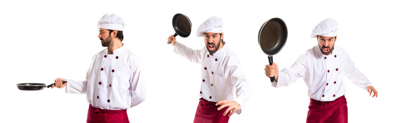 Wall Mural - Chef holding frying pan