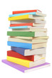 Untidy stack or pile of colorful paperback books isolated white background photo