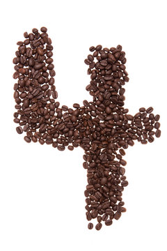 Roasted coffee beans placed in the shape of number four