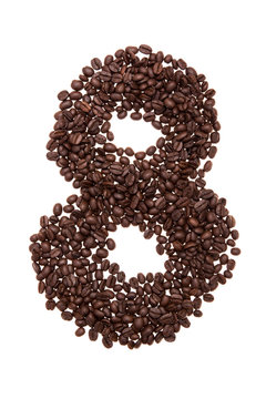 Roasted coffee beans placed in the shape of number eight