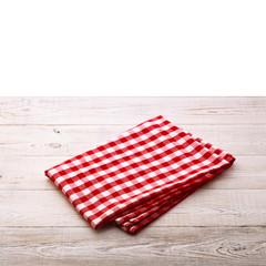 Wall Mural - Top view of checkered tablecloth on white wooden table.