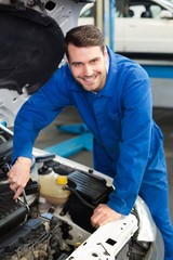 Poster - Mechanic examining under hood of car