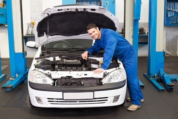 Poster - Mechanic examining under hood of car