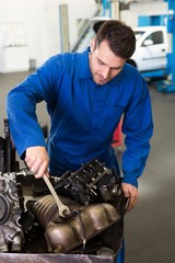 Poster - Mechanic working on an engine